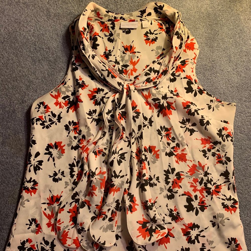 Flowing white tank top with black and red floral